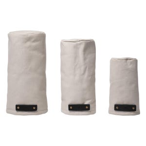 May include: Three cylindrical golf club head covers in varying heights, crafted from off-white fabric. Each cover features a rectangular black leather tab at the base, secured with two metallic rivets, providing a contrast to the light material.