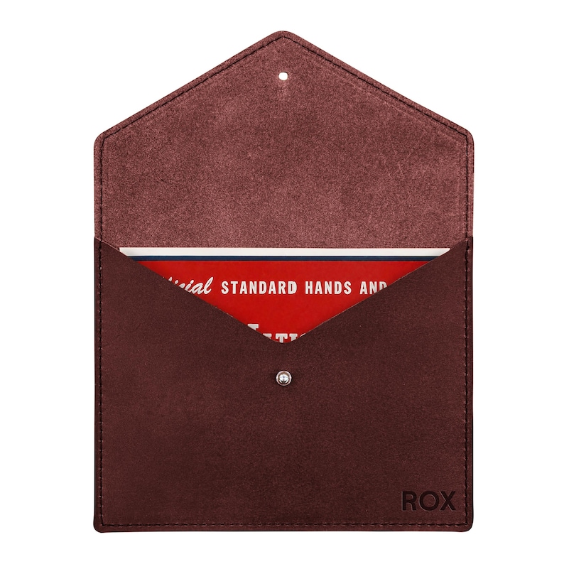 May include: A dark maroon suede envelope-style pouch with a pointed flap and a single silver snap closure. The word ROX is embossed in the bottom right corner. Inside, a red card displays the text: Official STANDARD HANDS AND.
