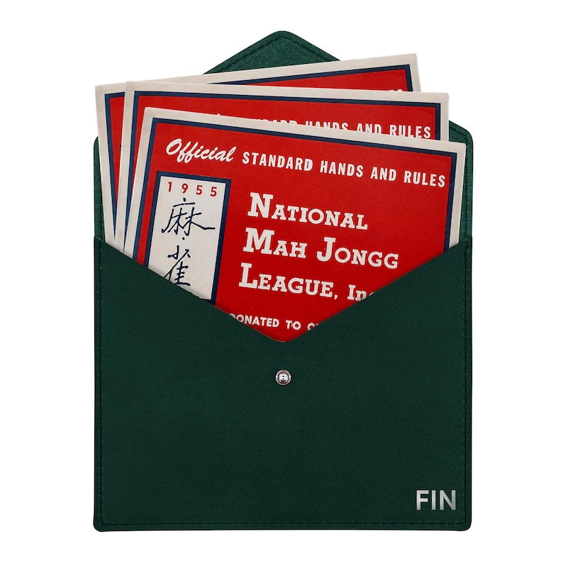 May include: A dark green envelope-style case with a silver snap closure and the word FIN printed in the corner. Inside are several red cards titled Official Standard Hands and Rules National Mah Jongg League, Inc. 1955 with Chinese characters.