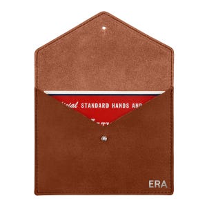 May include: A brown leather envelope-style pouch with a pointed flap and a silver snap closure. The bottom right corner features the embossed text ERA. Inside, a red card is visible with white text reading Official Standard Hands and.
