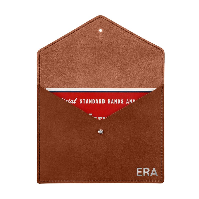 May include: A brown suede envelope-style pouch with a metal snap closure and the letters ERA embossed in the bottom right corner. Inside, a red card is visible with white text reading OFFICIAL STANDARD HANDS AND.