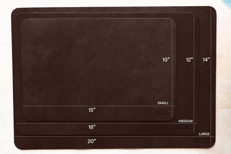 May include: A set of three brown rectangular mats in varying sizes. The smallest mat is 10 inches by 15 inches, the medium mat is 12 inches by 18 inches, and the largest mat is 14 inches by 20 inches. The word "ACE" is printed on each mat.