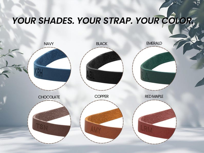 May include: Six circular cutouts display leather straps in navy, black, emerald, chocolate, copper, and red maple colors. Each strap features embossed initials. The text "YOUR SHADES. YOUR STRAP. YOUR COLOR." is centered at the top of the image.