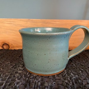 Turquoise pottery coffee mug