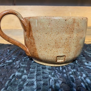 Light rust rounded pottery coffee mug