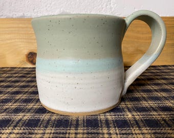 Icy turquoise and white pottery mug