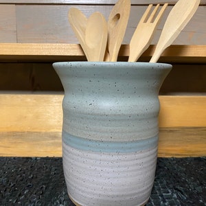 Icy turquoise and white pottery utensil holder