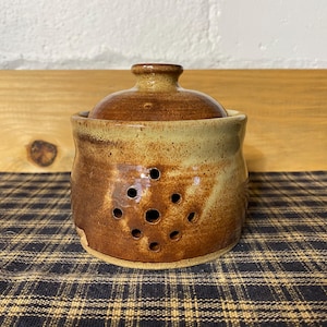 Light rust pottery garlic keeper