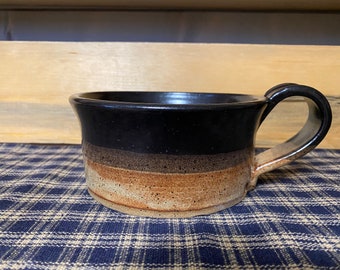 Black and light rust pottery soup mugs