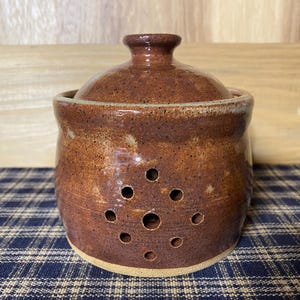 Light rust pottery garlic keeper