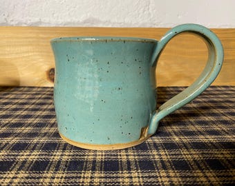 Turquoise pottery coffee mug