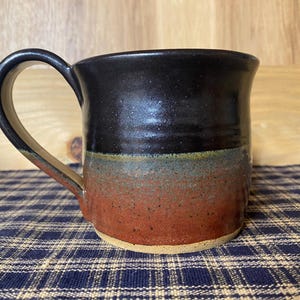 Iron red and black pottery mug