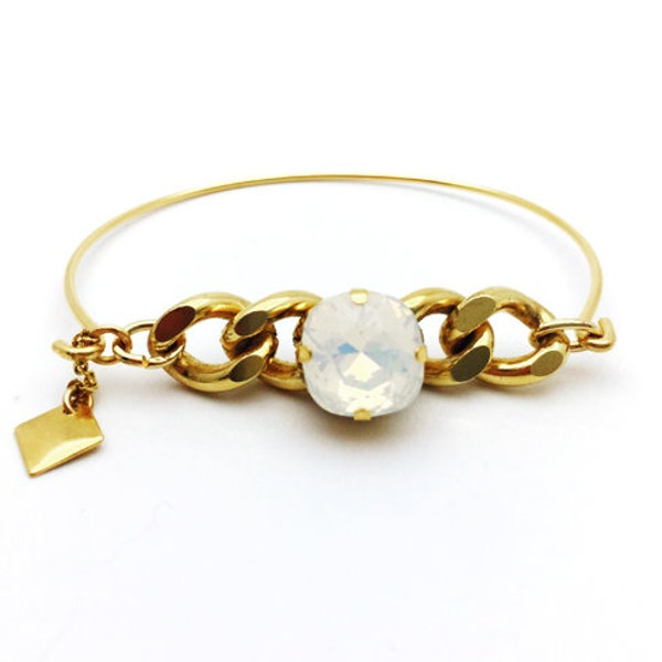 Bracelet jonc doré avec gourmette et cabochon en cristal