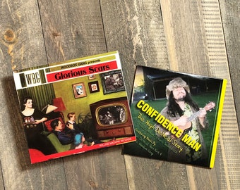 Woodbox Gang Glorious Scars on CD along with the Confidence Man Documentary Soundtrack, Save on shipping and buy this dual listing.