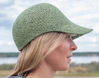 Light sporty summer cap with peak for her/him in elegant design.Handmade hat fashion from air-permeable paper yarn, in the colour khaki.Ciel
