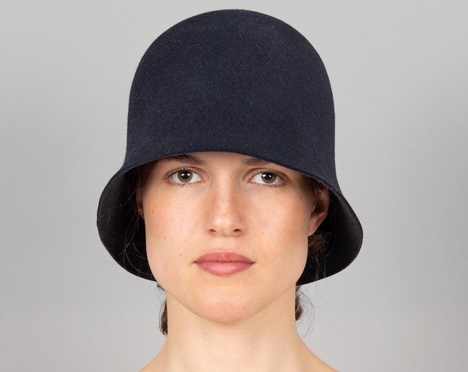 Featured listing image: Puristic cloche with a short, straight brim in the elegant colour midnight blue. Ingeniously pleated at the nape, with a soft cut edge, Liz