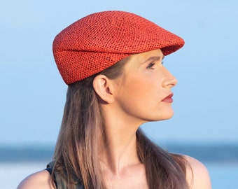 Lightweight summer cap for ladies in a refined design. Handmade, beautifully shaped unique hat made of twisted paper yarn in orange, Lou