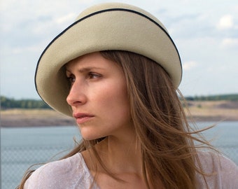 Refined ladies' hat with asymmetrical, turned-up brim made of fine velour felt. Handmade, extravagant derby hat in purist design, Sofia