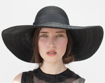 Black, elegant ladies summer hat with round headpiece and wide brim made of finely woven wheat straw. Handmade designer hat unique Emanuelle