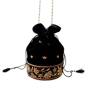 May include: A black velvet drawstring bag with a gold chain strap and gold embroidery. The bag features a floral design and is decorated with small gold beads.