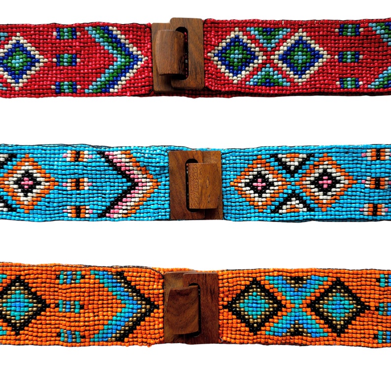 May include: Three beaded belts with wooden buckles. The belts feature geometric patterns in red, blue, and orange.