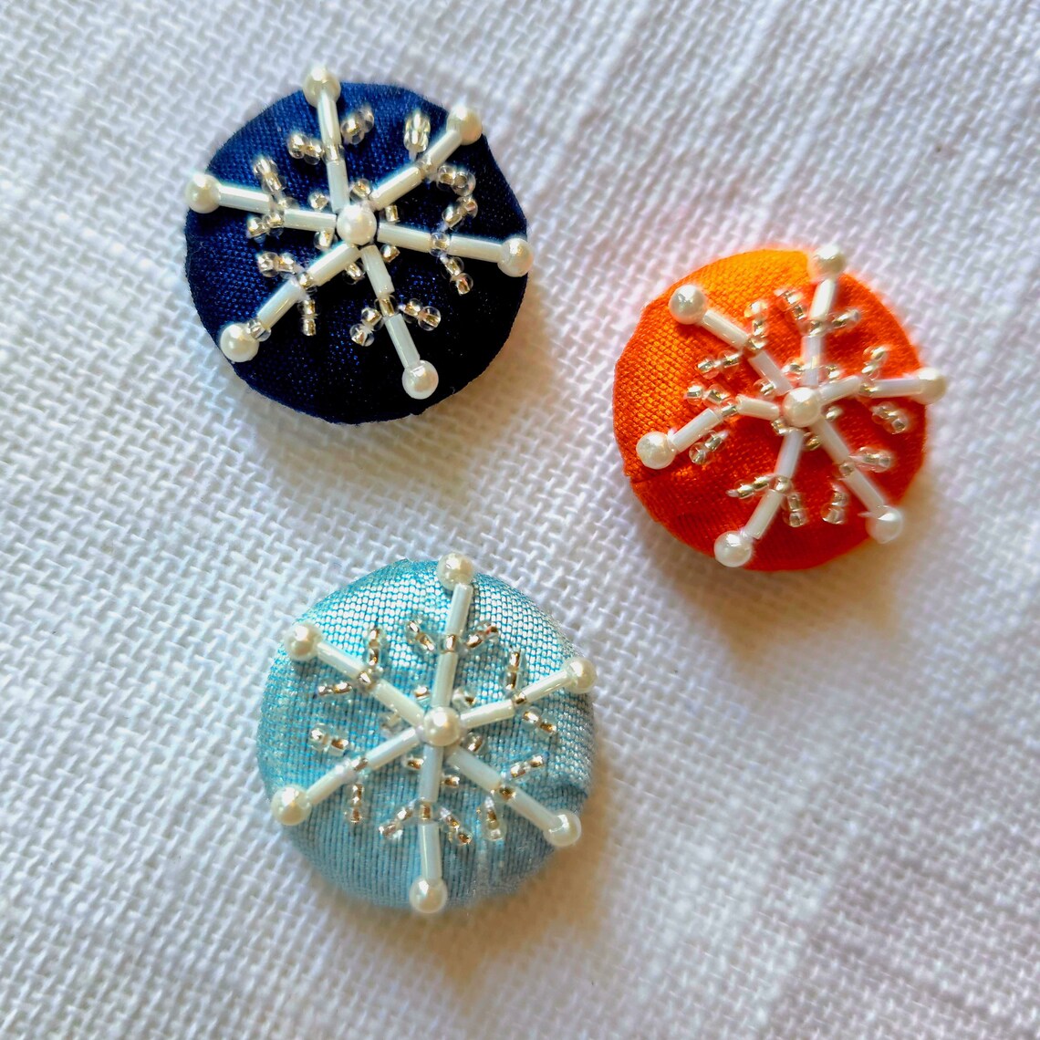 Handcrafted Snowflake Buttons: Beaded & Embroidered, Navy Blue Fabric ...