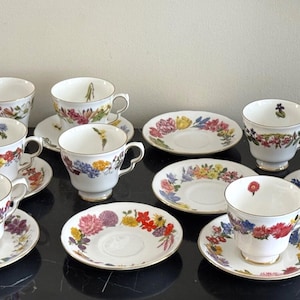 Royal Doulton Bone China Flowers of the Year By Leslie Greenwood Cps and Saucers