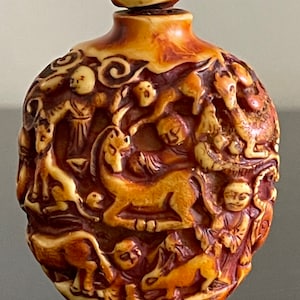 Vintage Chinese Stone Snuff Bottle with Intricate Carved Decoration