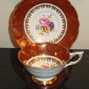 Royal Stafford Deep Red Gold Teacup and Saucer Numbered 4419 Plus Wood Stand