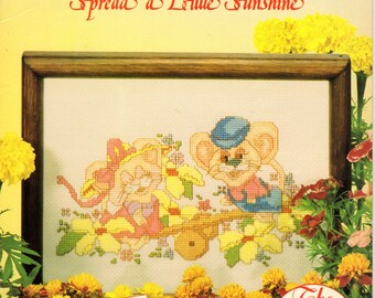 Cheesecakes Spread a Little Sunshine Cross Stitch Book -- The Steel Family