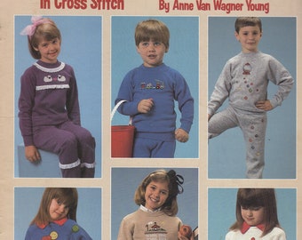 Kid's Sweats and Sweaters In Cross Stitch Book van Anne Van Wagner Young -- Leisure Arts -- Folder 433