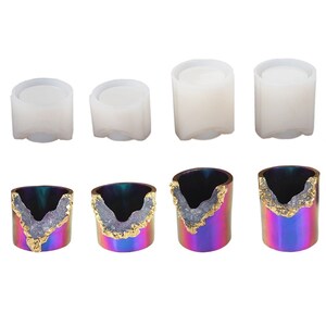 May include: Set of six silicone molds for making resin crafts. The molds are in three sizes and feature a geode design with a gold accent.