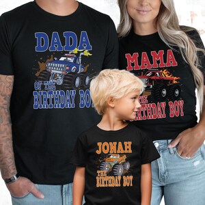 matching family wearing all black shirts with dada blue monster truck, mama red monster truck and birthday boy orange monster truck.
