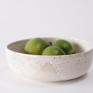 white speckled low bowl white matte glaze overlapping gloss glaze creating a subtle geometric pattern