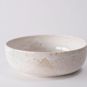 white speckled low bowl white matte glaze overlapping gloss glaze creating a subtle geometric pattern