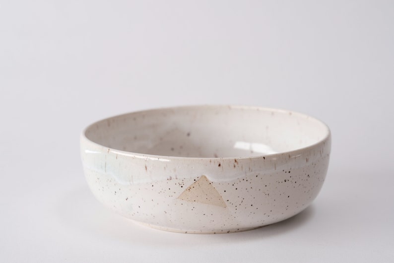 white speckled low bowl white matte glaze overlapping gloss glaze creating a subtle geometric pattern