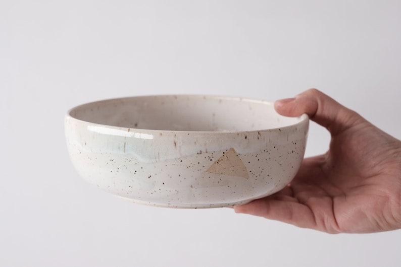 white speckled low bowl white matte glaze overlapping gloss glaze creating a subtle geometric pattern