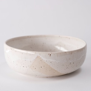 white speckled low bowl white matte glaze overlapping gloss glaze creating a subtle geometric pattern