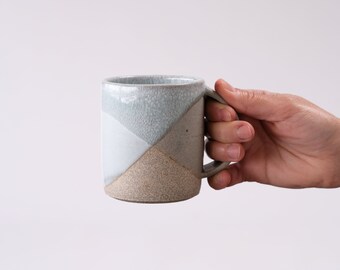 white and gray stoneware mug