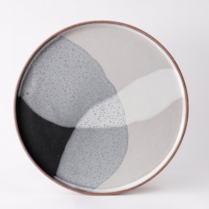 handmade red stoneware dinner plate, two tone black and white glazes overlapping