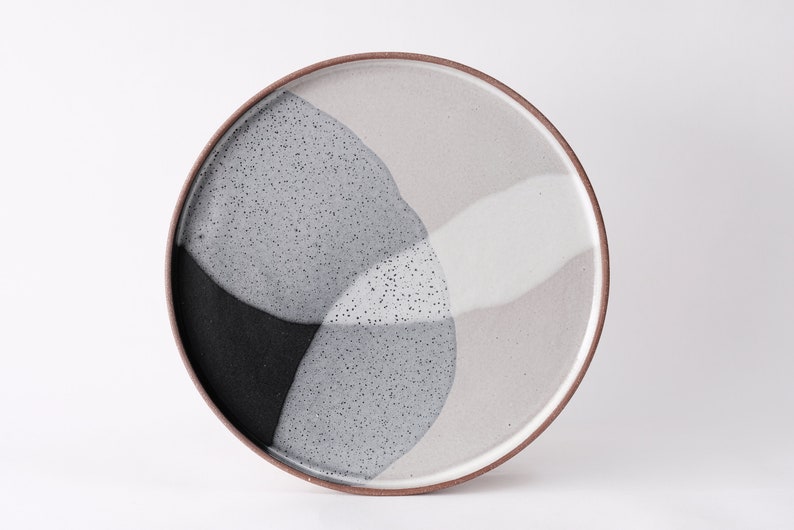 handmade red stoneware dinner plate, two tone black and white glazes overlapping