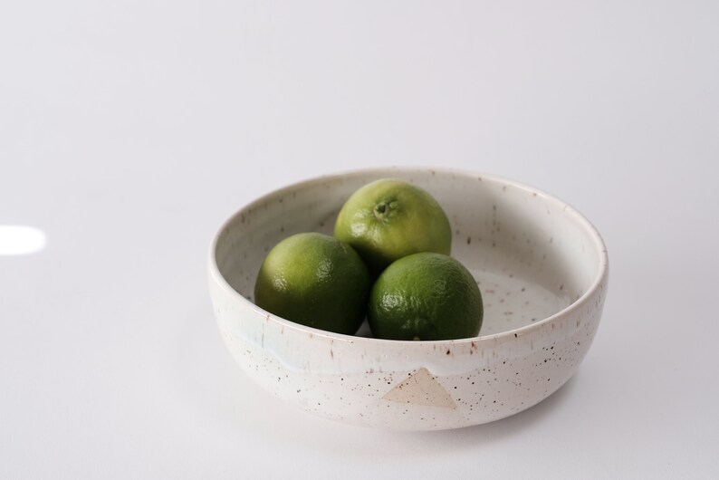 white speckled low bowl white matte glaze overlapping gloss glaze creating a subtle geometric pattern