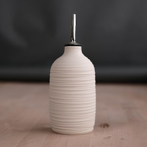 carved porcelain oil cruet