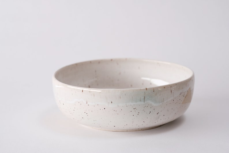 white speckled low bowl white matte glaze overlapping gloss glaze creating a subtle geometric pattern