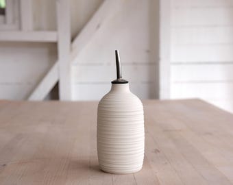 carved porcelain oil cruet