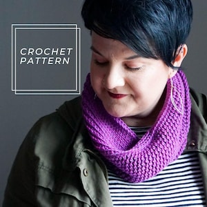 May include: A woman wearing a purple crocheted infinity scarf. The text "CROCHET PATTERN" is in a white box on a gray background.