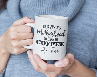 Surviving Motherhood Coffee Mug White 11oz or 320 ml, make a great Mother’s day, Birthday, Baby Shower or anniversary gift