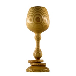 Front view of a handmade Magill Woodcraft Ireland Irish wedding goblet, made from Irish Ash wood of County Galway. The wooden challice also has two wooden captive rings around its stem, all made from the same piece of wood.