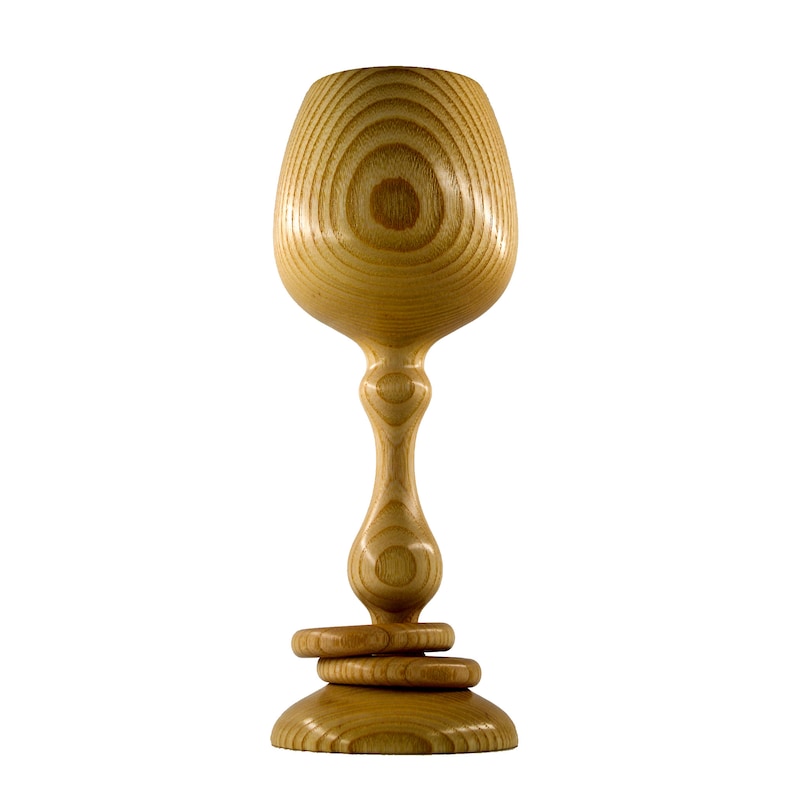 Front view of a handmade Magill Woodcraft Ireland Irish wedding goblet, made from Irish Ash wood of County Galway. The wooden challice also has two wooden captive rings around its stem, all made from the same piece of wood.