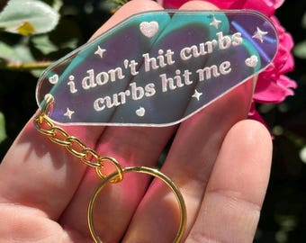 I don’t hit curbs, curbs hit me Iridescent Acrylic Motel Keychain